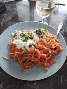 Plated spaghetti with white wine